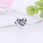 Ezust-sziv-charm-sarga-kis-szivekkel-