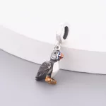 Ezüstözött lunda madár charm