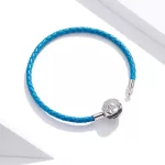 Türkiz bőr karkötő ezüs zárral hópehely motívummal 17 cm
