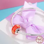 Narancssárga virágos üveg charm ezüst foglalatban